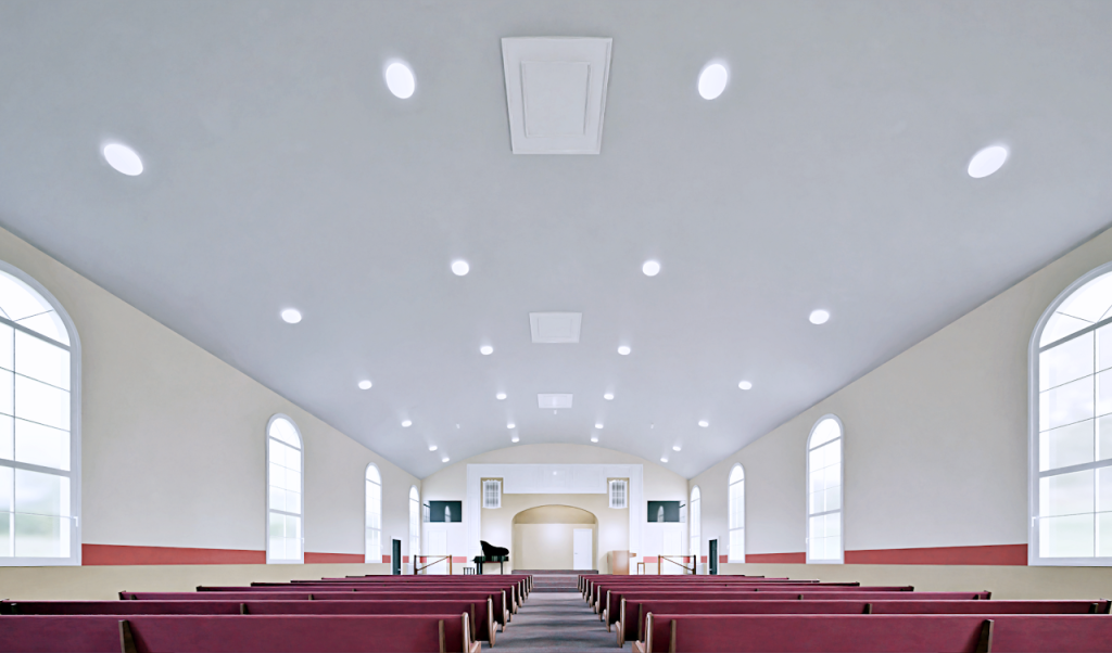 Wide renovation rendering down the church hall with new lighting and red pews
