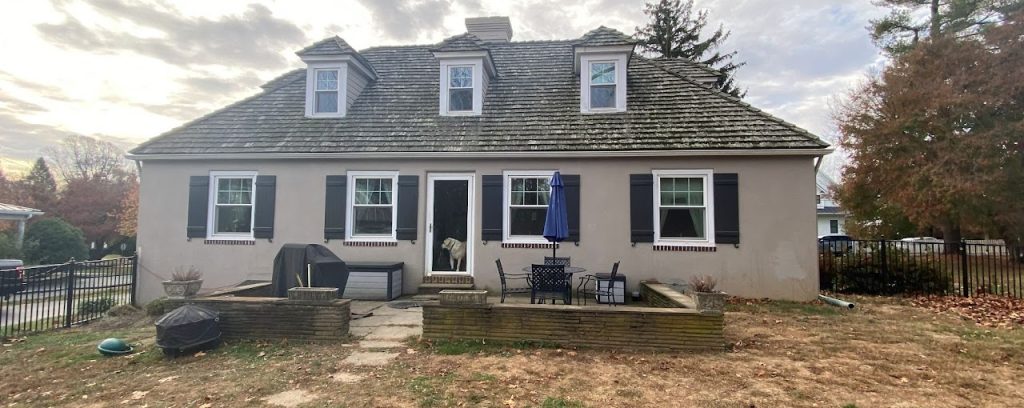 Existing rear elevation of the Wayne home before the covered deck addition