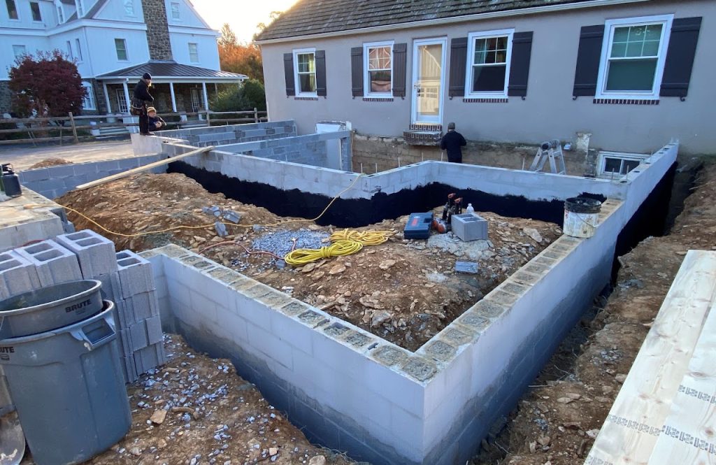 Foundation walls and excavation for the home addition