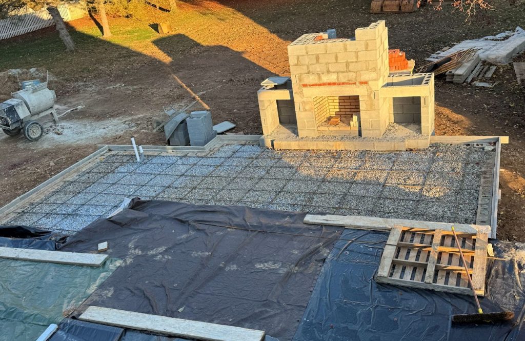Outdoor fireplace masonry and reinforced slab during construction