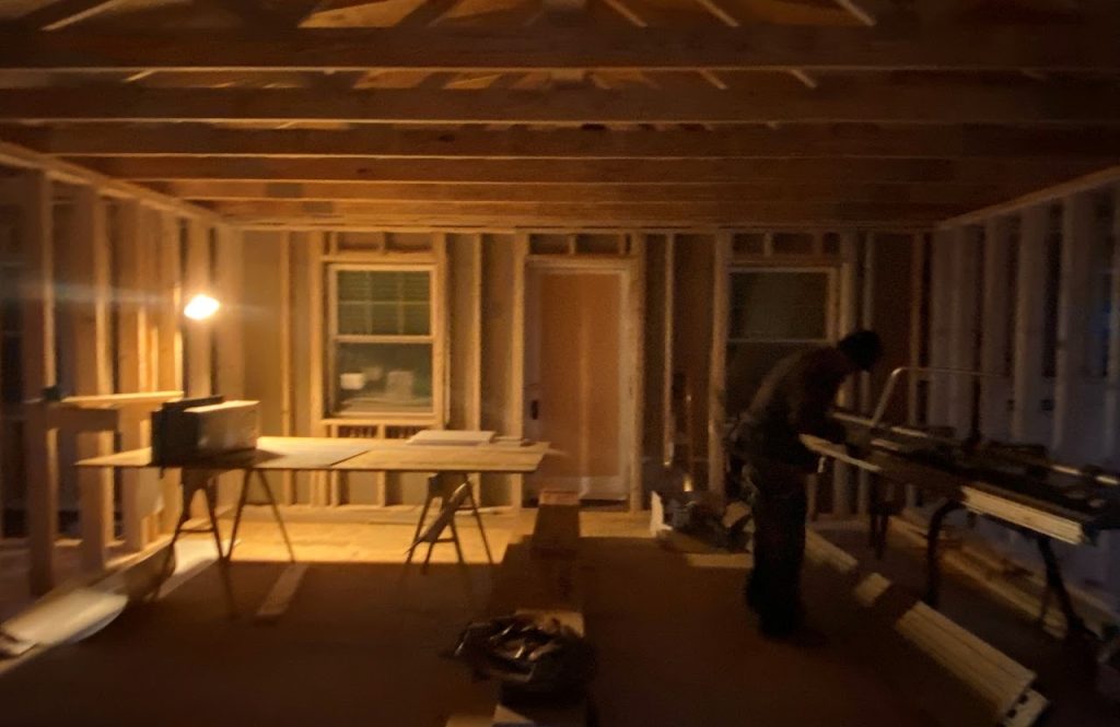 Interior wall framing inside the home addition during construction