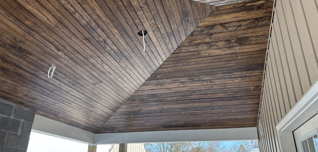 Finished wood ceiling beneath the covered deck roof