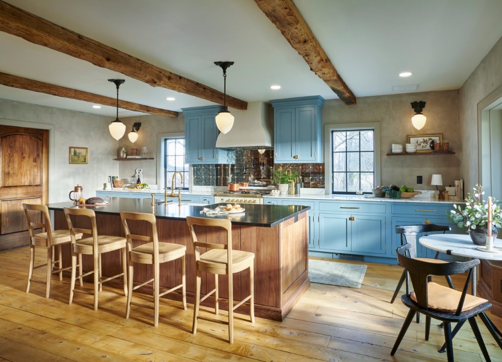 Completed kitchen and wood island viewed from the adjacent dining area