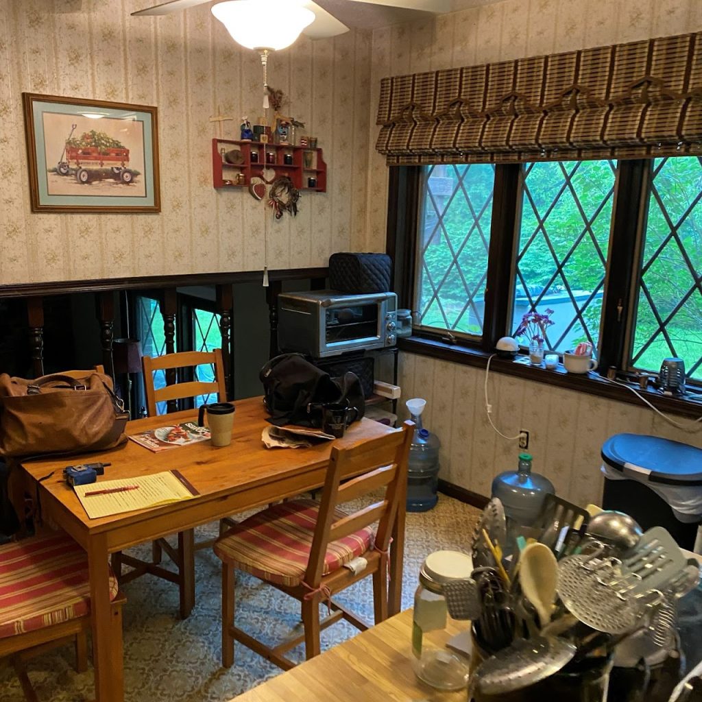 Existing kitchen dining nook with windows and freestanding table