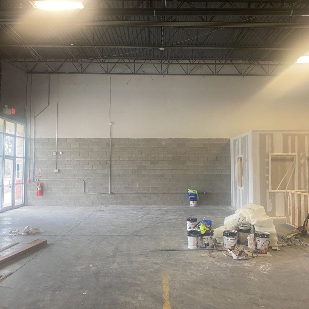 Warehouse renovation progress showing new office wall framing
