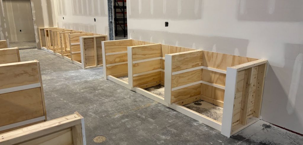 Wood framing for the new reception counter during office construction