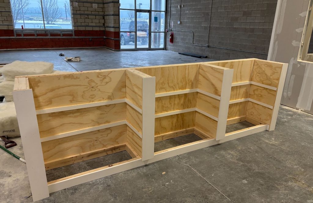 Close view of the framed reception counter in the warehouse office