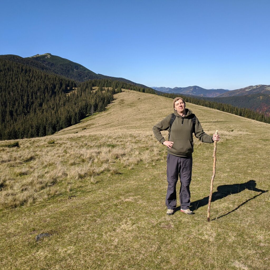 Oleksii Dobriakov, founder of KF Design, hiking in the mountains
